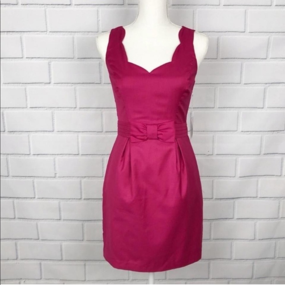 Pink contemporary scalloped bow-front dress